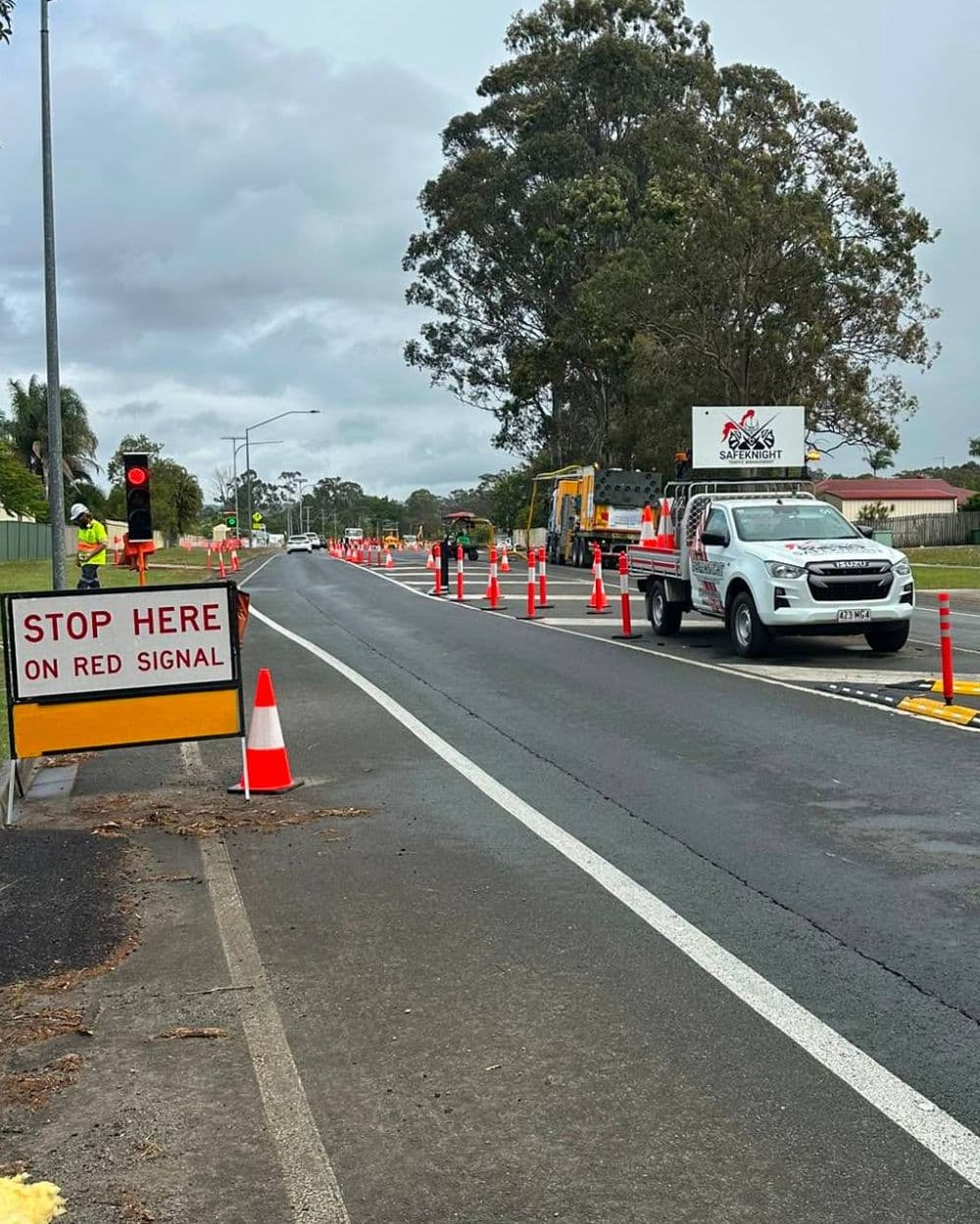 Safe Knight lane closure with stop sign, portable traffic lights, bollards and branded ute